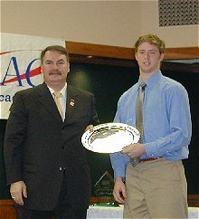 Marc Cavosie received POTY from John Rooney of AVAYA