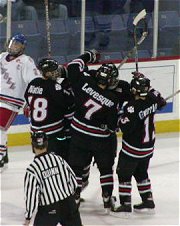 The Huskies celebrate as they force Game 3