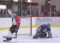 Carl Boben (13) scores a short-handed goal in the third period for River Falls.