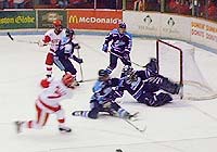 BU's Bryan Miller scores on Mike Morrison for the Terriers' second goal. Later, Miller suffered a separated shoulder. (photos by Scott Weighart)