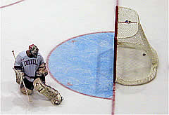 Cornell goalie Matt Underhill looks at the winning goal that just went past him, as Harvard upended the Big Red, 4-3, in overtime. (photos by Jayson Moy)