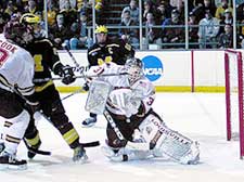 Hobey finalist Wade Dubielewicz was makes a stop against Michigan in Denver's 5-3 loss. (photo by Christopher Brian Dudek)