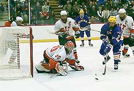 RIT's Tyler Euverman directs a rebound just out of harm's reach.