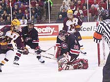 Dean Weasler stops the Gophers' Grant Potulny for one of his 37 saves on the night. (photos by Jason Waldowski)