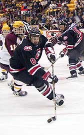 St. Cloud's Jeff Finger (8) gets away from Minnesota's Erik Wendell.