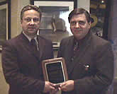 Dave Hendrickson (l.) receives The Concannon Award from HEA Commissioner Joe Bertagna