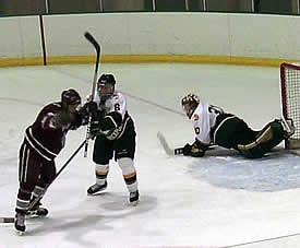 John Bernfell's shot slips past Brockport goalie Brian Tefft to give Potsdam a 3-0 lead in the first.  (Photos by Russell Jaslow)