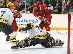 Stephen Baby (top right) was stopped on this attempt by Mike Walsh, but the Cornell captain would eventually score twice. (photo: ELynah.com)