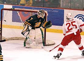 Vermont goalie Shawn Conschafter looks on helplessly, as Sam Paolini buries a 5-on-3 goal over his shoulder. (photos: eLynah.com)