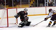 Phil Lewandowski scores on a breakaway against Bowling Green's Tyler Masters. (photos: Christopher Brian Dudek)