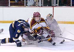 Notre Dame's Brad Wanchulak and FSU's Jeff Legue pile up in front of Irish goalie Morgan Cey's crease. (photo: Christopher Brian Dudek)