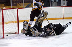 Greg Rallo scores the eventual game winner past Bronco goalie Scott Foster.