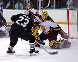 Ferris State goalie Mike Brown made 28 saves, including this one on Western Michigan's Brent Walton. (Photos by Christopher Brian Dudek)