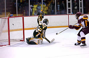 Mike Kinney scores the Bulldogs' only goal, roofing it over Kowalski.