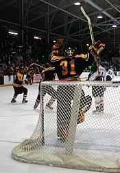 Mike Boudreau celebrates as the buzzer sounds.