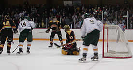 John Hirliman (14, White) tipped Andy Rozak's shot to put Oswego up 3-2 in the second.