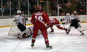 Jeff Hopkins (25) puts Plattsburgh on the scoreboard early in the first period with one of the Cardinals' two powerplay goals.