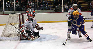 RIT goalie Tyler Euverman steers aside an Elmira shot, one of 36 saves on the night. (Photos by Russell Jaslow)