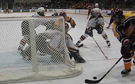 St. Norbert Chancy Colquhoun guards the post against the Norwich attack.