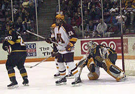 Vanek (26) parks in front of Tiger goalie Curtis McElhinney.