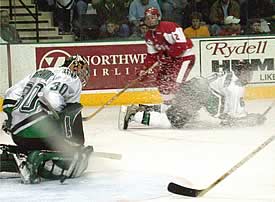 Fighting Sioux goalie Jake Brandt makes a pad save in the sophomore's second consecutive shutout and third of the season. (Photos by Patrick C. Miller)