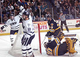 New Hampshire's Tim Horst (19) and Pat Foley celebrate as Horst scores on Merrimack's Joe Exter. (photos by Josh Gibney)