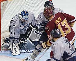 Mike Ayers, here stopping Tony Voce, was brilliant again in net, with 34 saves including six in OT.