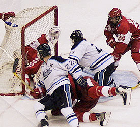 There's a pile up in the crease as the winning goal for Maine makes it way across the goal line. (photo: Wayne Killam)