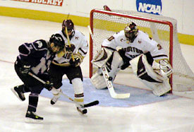 Niagara's Joe Tallari redirects a shot past Matti Kaltiainen.