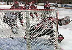 Rachel Barrie of SLU makes a key kick save. (Photo: Russell Jaslow)