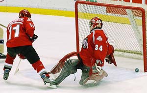 Mike Betz allows Aaron Gill's first of three goals. The OSU goalie was pulled after letting in five, but Mike Caruso won in relief. (photos: Christopher Brian Dudek)