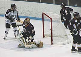 Quinnipiac defenseman Troy Maleyko tried to knock the net off to save a goal, but to no avail, as Providence's Chris Chaput made it 5-0. (photos: Danielle Garofalo)