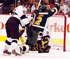 UAA's Curtis Glencross (82) celebrates Brandon Segal's goal Thursday (photo: Jason Waldowski).