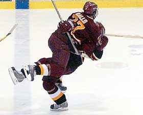 Brett Smith is mobbed by FSU teammate Greg Rallo after scoring the OT game winner. (photos: Christopher Brian Dudek)