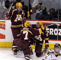 Keith Ballard (l.), Gino Guyer and Danny Irmen celebrate Irmen's first goal (photo: Jason Waldowski).