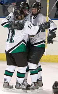 Rastislav Spirko (11) and Travis Zajac (15) help Drew Stafford celebrate Stafford's goal Friday against BU (photos: Melissa Wade).