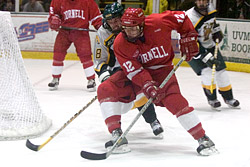 Cornell's Ray Sawada tries to keep the puck from Vermont's Derek Wagar.