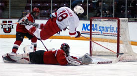 Big Red forward Mike Iggulden goes airborne as he scores the winning goal Saturday (photo: Jason Waldowski).