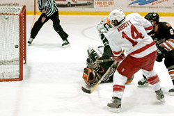 Cam Abbott scores on a breakaway for Cornell, beating Eric Leroux. (photo: eLynah.com)