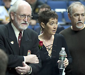 Patty Sertich, 52, was diagnosed with a brain tumor last year. She was escorted to the Hobey ceremony by a Committee official (left) and husband Steve. (photo: Melissa Wade)