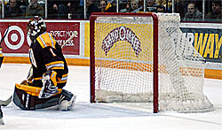 UMD goalie Josh Johnson watches Nate Hagemo's game winner go by (photo: Jason Waldowski).