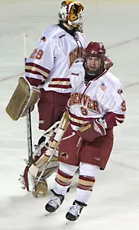 Gabe Gauthier (front, with netminder Peter Mannino) scored three times to lead DU back to the Frozen Four (photos: Melissa Wade).