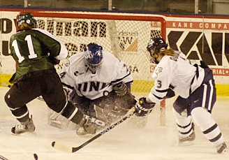 UNH goalie Melissa Bourdon stops a shorthanded bid by Dartmouth's Gillian Apps. (Credit: Josh Gibney)