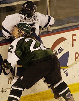 Dartmouth's Emily Nerland boards UNH's Lindsay Hansen and earns a five-minute major. (Credit: Josh Gibney)