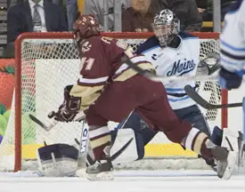 Benn Ferriero scores on Maine netminder Ben Bishop.