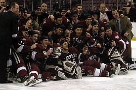 Harvard celebrates its ECACHL title win (photo: Jessica Zbikowski).