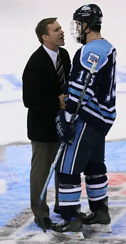 Wisconsin's Mike Eaves warmly greets Maine's Greg Moore. Eaves coached the Black Bear on both the U.S. National Development Under-18 team and on the World Juniors squad. (photo: Melissa Wade)