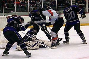 Niagara clears the puck from in front of the net.  