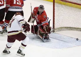 Joe Rooney scores on Brad Thiessen to tie the game at 1 in the first period (photos: Melissa Wade).