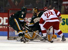 Vermont's Joe Fallon looks back over his shoulder to see the puck hit the back of the net.